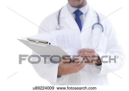 Doctor holding clipboard, close-up. View Large Photo Image Stock Photo - Doctor holding clipboard, close-up.. Fotosearch