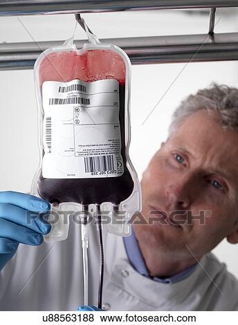 Stock Photo - Donor blood processing. The donor blood is being separated into its component parts.. Fotosearch