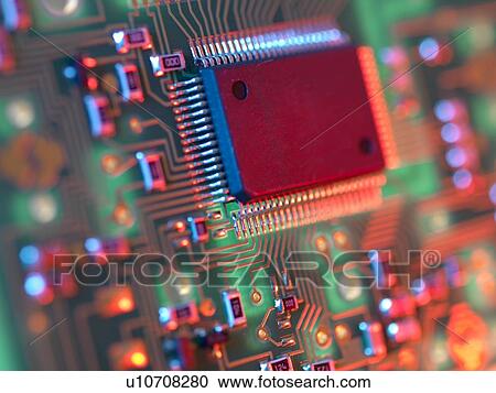 Stock Image - Electronic circuit board containing chips and components.. Fotosearch