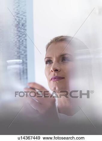 Genetics research. Scientist viewing DNA (deoxyribonucleic acid) results on a autoradiogram. View Large Photo Image Stock Photo - Genetics research. Scientist viewing DNA (deoxyribonucleic acid) results on a autoradiogram.. Fotosearch