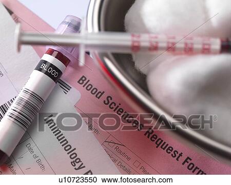 Stock Image - Human blood sample alongside blood test request form.. Fotosearch