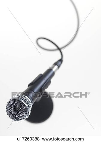 Stock Photo - Microphone awaiting a speaker.. Fotosearch
