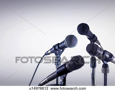 Microphones awaiting a speaker. View Large Photo Image Stock Image - Microphones awaiting a speaker.. Fotosearch