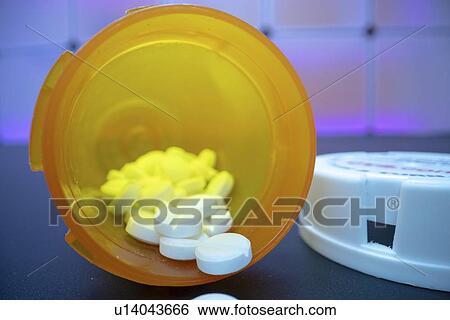 Pills spilling from bottle. View Large Photo Image Stock Photograph - Pills spilling from bottle.. Fotosearch