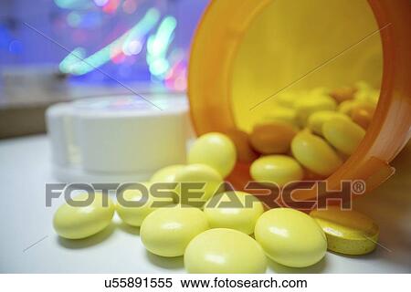 Stock Photography - Pills spilling from bottle.. Fotosearch
