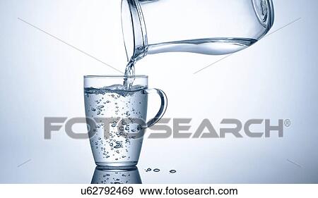 Stock Photo - Pouring water from jug.. Fotosearch
