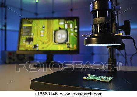 Stock Photograph - Quality control in microchip factory.. Fotosearch