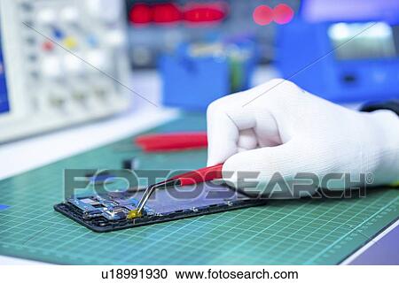 Repairing mobile phone. View Large Photo Image Stock Image - Repairing mobile phone.. Fotosearch