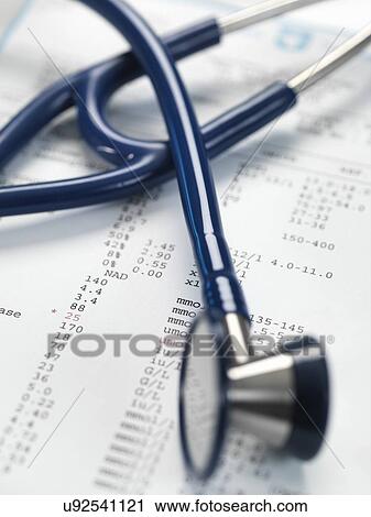 Stock Image - Stethoscope sitting on a set of blood results.. Fotosearch