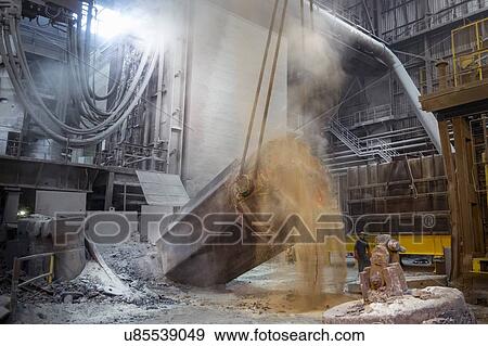 Stock Photo - 200 ton steel ingot being tipped in steelworks. Fotosearch