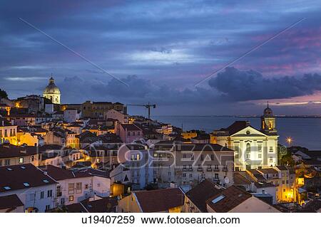 Stock Photo - Alfama district at night, Lisbon, Portugal. Fotosearch