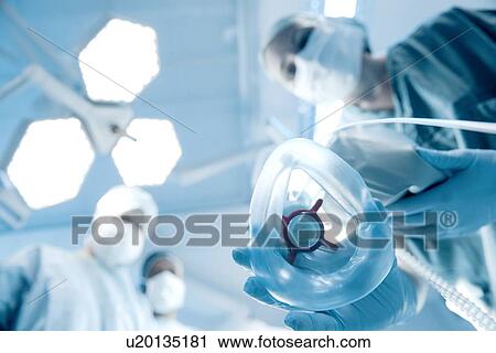 Anaesthetist placing mask on patient View Large Photo Image Stock Image - Anaesthetist placing mask on patient. Fotosearch