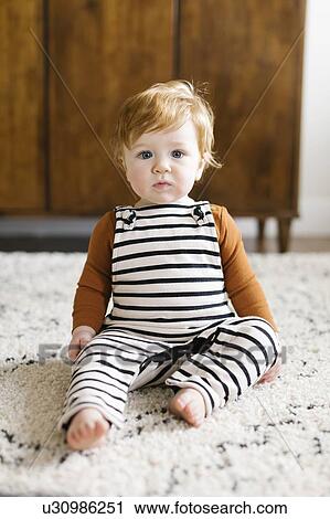 Baby boy wearing striped overalls View Large Photo Image Stock Image - Baby boy wearing striped overalls. Fotosearch