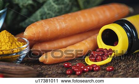 Beta carotene supplement pills and vegetables View Large Photo Image Stock Image - Beta carotene supplement pills and vegetables. Fotosearch