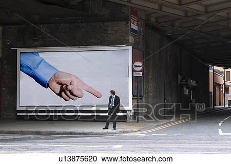 Billboard pointing at pedestrian View Large Photo Image Stock Image - Billboard pointing at pedestrian. Fotosearch