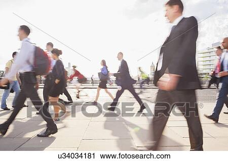 Stock Image - Blurred commuters at rush hour. Fotosearch