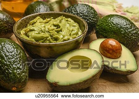 Picture - Bowl of guacamole with avocados. Fotosearch