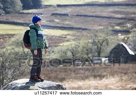 Boy exploring national park, Llanaber, Gwynedd, United Kingdom View Large Photo Image Stock Photo - Boy exploring national park, Llanaber, Gwynedd, United Kingdom. Fotosearch