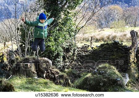Stock Photograph - Boy exploring national park, Llanaber, Gwynedd, United Kingdom. Fotosearch