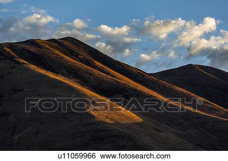 Stock Photograph - Brown hills in shadow in Bellevue, Idaho, USA. Fotosearch