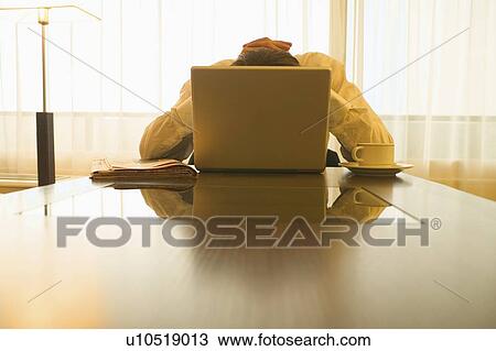 Businessman behind laptop View Large Photo Image Stock Image - Businessman behind laptop. Fotosearch