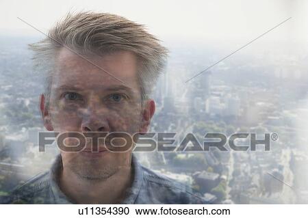 Businessman looking through window View Large Photo Image Stock Image - Businessman looking through window. Fotosearch