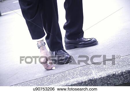 Businessman picking up coin View Large Photo Image Stock Photograph - Businessman picking up coin. Fotosearch