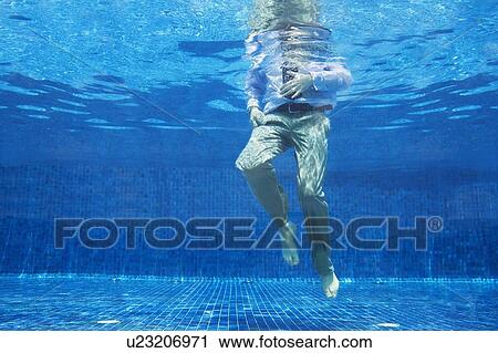 Stock Image - Businessman underwater. Fotosearch