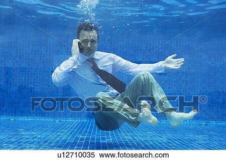 Stock Photography - Businessman underwater. Fotosearch
