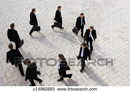 Businessman walking in circles View Large Photo Image Stock Image - Businessman walking in circles. Fotosearch