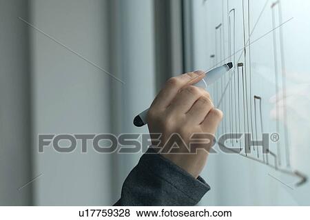 Businesswoman drawing graph on whiteboard View Large Photo Image Stock Photo - Businesswoman drawing graph on whiteboard. Fotosearch