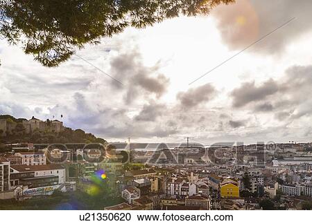 Stock Image - Central Lisbon with Castelo de So Jorge and Ponte 25 de Abril, Lisbon, Portugal. Fotosearch