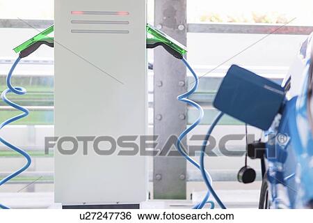 Charging electric car View Large Photo Image Stock Photograph - Charging electric car. Fotosearch