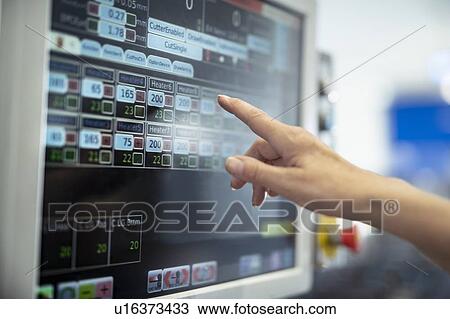 Close up of workers hand on control panel in print factory View Large Photo Image Stock Image - Close up of workers hand on control panel in print factory. Fotosearch