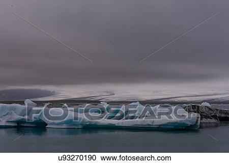 Stock Image - Coastal landscape with icebergs and stormy sky, Skaftafell, Austur-Skaftafellssysla, Iceland. Fotosearch