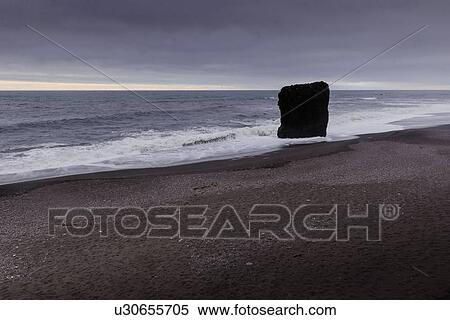 Coastal landscape with overcast sky and rock formation, Skaftafell, Austur-Skaftafellssysla, Iceland View Large Photo Image Stock Photography - Coastal landscape with overcast sky and rock formation, Skaftafell, Austur-Skaftafellssysla, Iceland. Fotosearch
