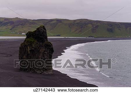 Stock Image - Coastal landscape with rock formation on beach, Reynisdrangar, Vik, Iceland. Fotosearch