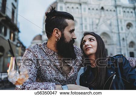Couple gazing lovingly into each other's eyes in cafe, Santa Maria del Fiore, Firenze, Toscana, Italy View Large Photo Image Stock Photo - Couple gazing lovingly into each other's eyes in cafe, Santa Maria del Fiore, Firenze, Toscana, Italy. Fotosearch