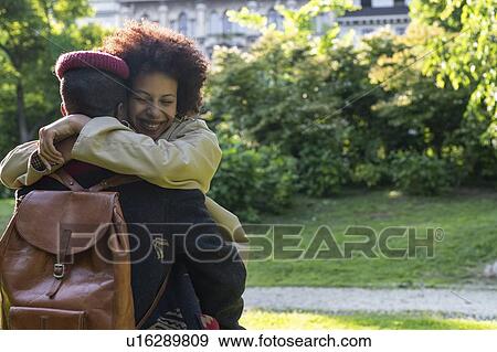Stock Photo - Couple hugging in park, Milan, Italy. Fotosearch