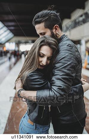 Couple hugging in station View Large Photo Image Stock Image - Couple hugging in station. Fotosearch