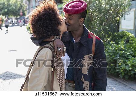 Couple kissing in street, Milan, Italy View Large Photo Image Stock Photo - Couple kissing in street, Milan, Italy. Fotosearch