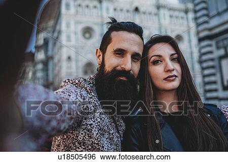 Stock Photograph - Couple taking selfie in cafe, Santa Maria del Fiore, Firenze, Toscana, Italy. Fotosearch