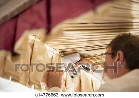 Curtain fitter stapling material to four poster bed, close up View Large Photo Image Stock Image - Curtain fitter stapling material to four poster bed, close up. Fotosearch