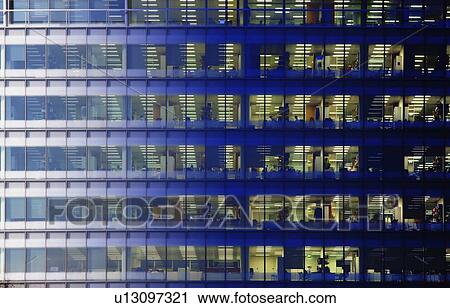 Stock Image - Day to night image of an office block. Fotosearch