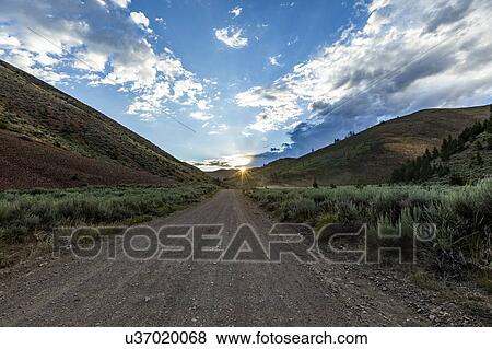 Stock Photo - Dirt road through valley in Bellevue, Idaho, USA. Fotosearch