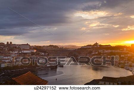 Stock Image - Douro River and Porto skyline at sunset, Porto, Portugal. Fotosearch