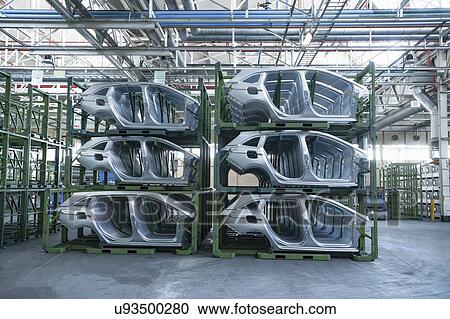 Dressed car parts in car factory View Large Photo Image Stock Image - Dressed car parts in car factory. Fotosearch