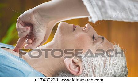 Stock Photo - Facial marma therapy, ayurveda neck massage (kanth marma). Fotosearch