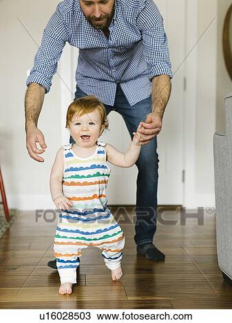 Father helping baby boy to walk View Large Photo Image Stock Image - Father helping baby boy to walk. Fotosearch