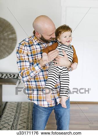 Father holding his son View Large Photo Image Stock Photograph - Father holding his son. Fotosearch